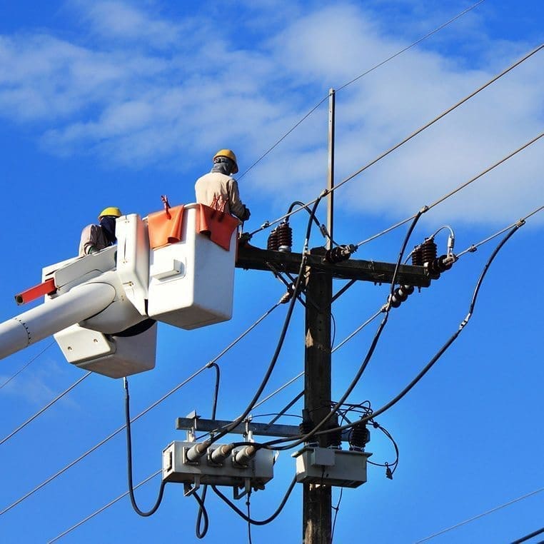 electricians repairing power line